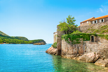 Fototapeta na wymiar Beautiful summer landscape of the Adriatic coast in The Budva Riviera with a view of the Sveti Stefan