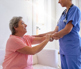 Shes a great helping hand. Cropped shot of a caregiver assisting a senior patient in a nursing home.