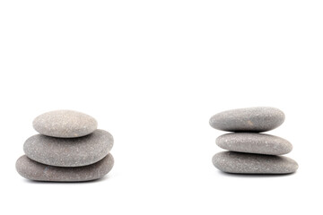 Fototapeta na wymiar Zen stones on a light background. Minimalistic concept. Zen balance miditation concept. For branding and product presentation.