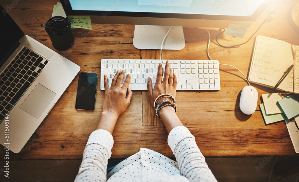 Poster productivity is in the hands of the hard worker. cropped high angle shot of a businesswoman using a 