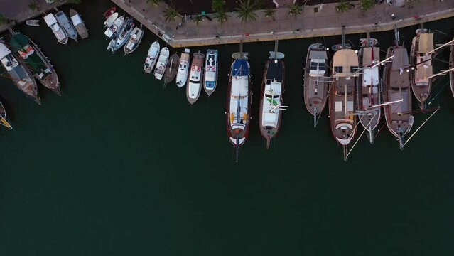 Aerial view of various types of boats docked near the coast at the Aegean sea. Bodrum marina of Turkey.