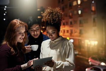 Working together to create the perfect design. Shot of a group of young designers working late in the office.
