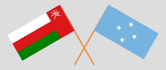 Crossed flags of Oman and Micronesia. Official colors. Correct proportion