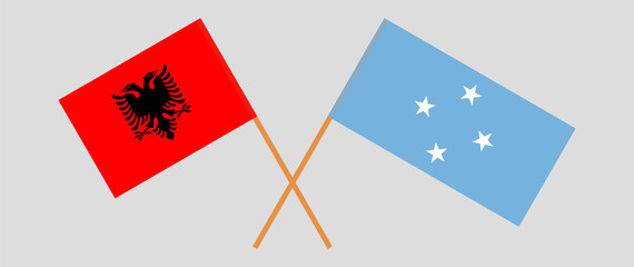 Crossed flags of Albania and Micronesia. Official colors. Correct proportion