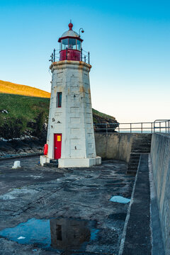 Sunset over Lybster Lighthouse and Harbour, East Coast of Scotland , UK
