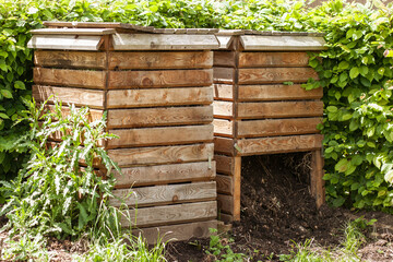 Bio Fertilizer in Composter. Compost Box with Humus on Garden. Recycling Organic Waste in Compost...