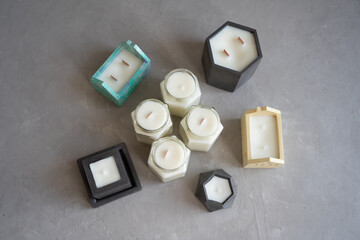 Interior candles in candlesticks of different shapes. Natural soy wax.