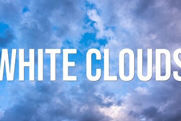 WHITE CLOUDS - word on the background of the sky with clouds.