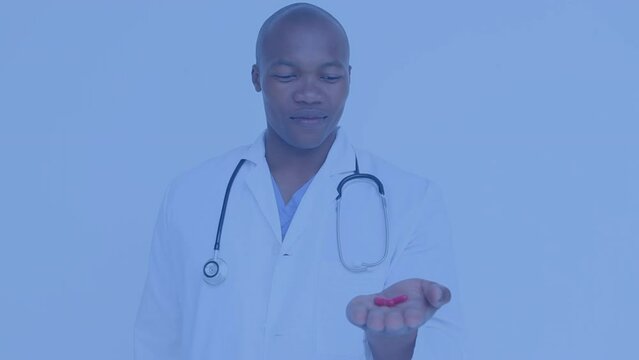 Animation of slava ukraini text over african american male doctor