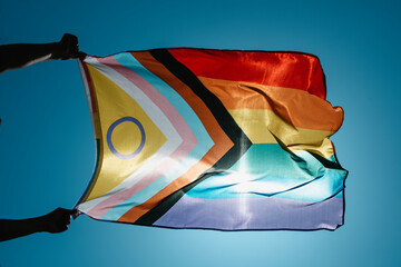 waves an intersex-inclusive progress pride flag - 511516148