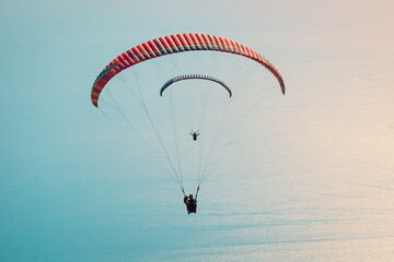Paragliders flying over the Oludeniz Beach, Fethiye. Mugla, Turkey. Paragliding concept and background