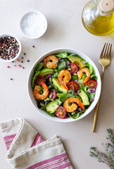 Salad with shrimps, avocado, tomatoes, onions and seeds. Healthy eating. Diet.
