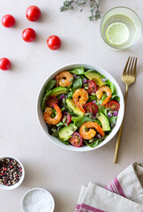 Salad with shrimps, avocado, tomatoes, onions and seeds. Healthy eating. Diet.