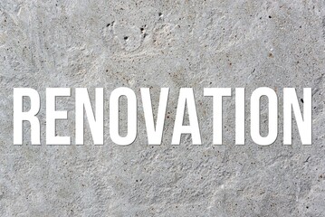 RENOVATION - word on concrete background. Cement floor, wall.