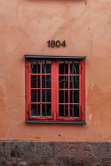 red window on the wall
