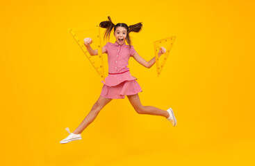 Fototapeta na wymiar Amazed teenager. School girl holding measure for geometry lesson, isolated on yellow background. Measuring equipment. Student study math. Excited teen schoolgirl. Crazy jump, jumping kids.
