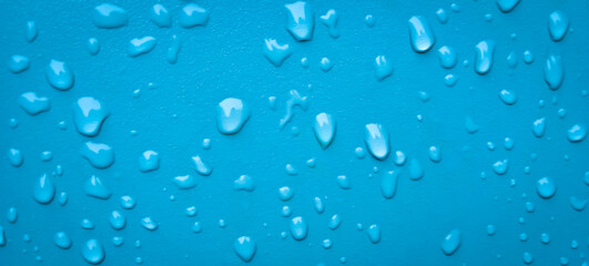 Abstract water drops on the blue wall. Suitable for promotion and advertising, website, tech industry and company, etc.