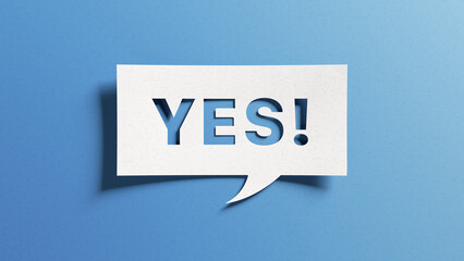 Yes sign showing positive answer, joy, agreement, celebration, affirmative decision or determination. Word yes on cutout paper speech buble on blue background.