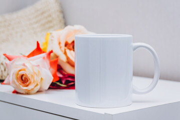 White cup of coffee on table, mockup.