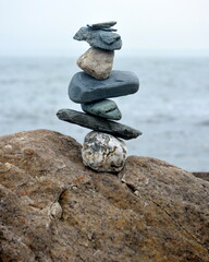 Fototapeta na wymiar Rock cairn by ocean