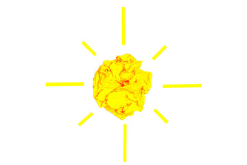 Sun made from paper ball and strips on white