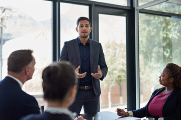 Ironing out the details. Shot of corporate businesspeople meeting in the boardroom.