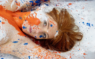 abstract art portrait of a seductive young brunette redhead woman, dots of blue, white and orange...