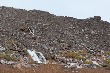 The concept of consumption and pollution. A lot of waste is thrown away. Aerial view and top view. City of Krivoy Rog, Ukraine. Huge garbage dump