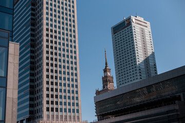 Modern city with office, finance and business buildings in sunny day. Warsaw, Poland.