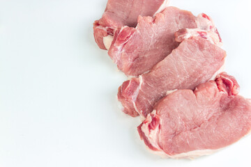 Fresh meat on white background, Raw beef steak and spices for cooking with copy space.