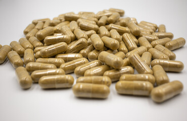 Herbal capsule, dietary supplement, vitamin tablet, herbal medicine on a white background