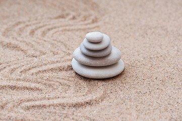 Fototapeta na wymiar Sand and stone for harmony and balance. Meditation, stone, concentration and relaxation