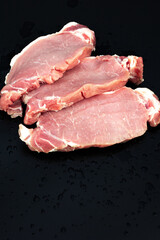 Raw veal meat fillet on dark background, Raw beef meat steaks for grilling on dark background.