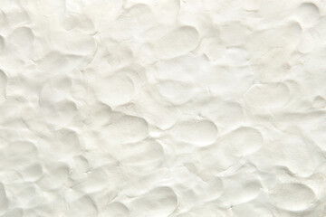 White plasticine texture with finger prints. Modeling clay material pattern background.