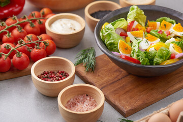 Diet menu. Healthy salad of fresh vegetables - tomatoes, egg, Onion. high angle view of a nutritious vegetable salad with boiled egg slices, served.  Healthy meal concept.