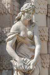 Old sculpture of a sensual woman nymph bathing at the fountain in Zwinger gardens at historical and...