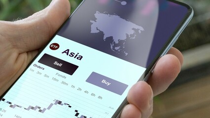 Asia, an investor buy or sold an etf fund asia, invest in ETF. © maurice norbert