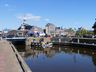 Fototapeta na wymiar View towards the center of (Dutch) Lemmer (Frisian) De Lemmer (port town on the Ijsselmeer, a very big lake), Friesland, Netherlands, left a lift bridge