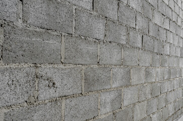 Gray brick wall. Abstract gray rough background. Brickwork.