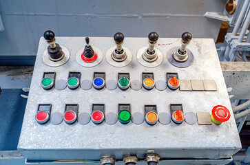 Control panel for the machine. Production background. Buttons, toggle levers.