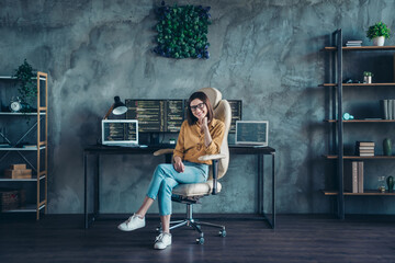 Portrait of attractive cheerful girl technician partner web developer sitting in chair at workplace...