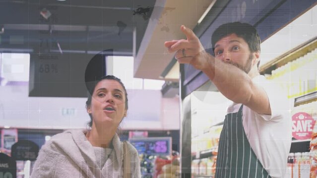 Animation of financial graphs over happy caucasian male seller and female customer in grocery shop - Powered by Adobe