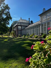 Beautiful old greenhouse in an English garden at the afternoon, perfect tea time 