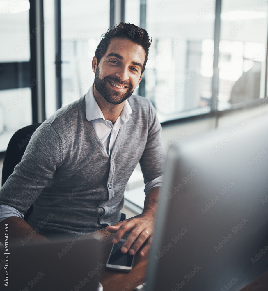 Poster success is created by the effort you put in. portrait of a young businessman working on a computer i