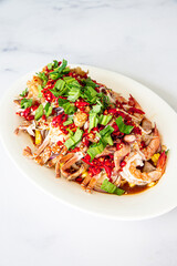 Spicy salad seafood on tray, Salad Thai cuisine spicy delicious seafood with crab shrimp cockle and spices ingredient lemon lime tomato fresh chilli spicy food