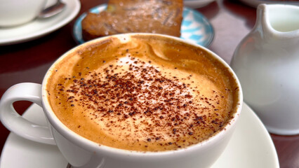 Cup of Cappucino at a street cafe - close up view - travel photography