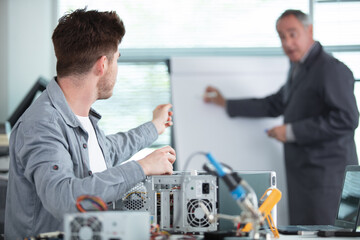 future electronic assembler with his teacher