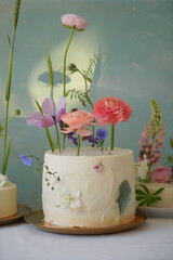 Wedding cake with flowers in sunset light