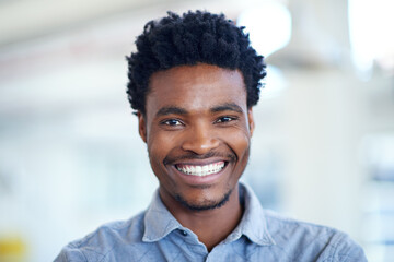 He greets every business day with a smile. Portrait of a handsome young businessman.