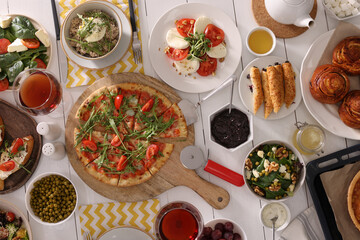 Many different dishes served on buffet table for brunch, flat lay